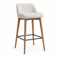 Tabouret de bar rembourré en tissu bouclé blanc cassé avec dossier incurvé, pieds en bois et repose-pieds en métal noir, 55 × 53 × 96 cm